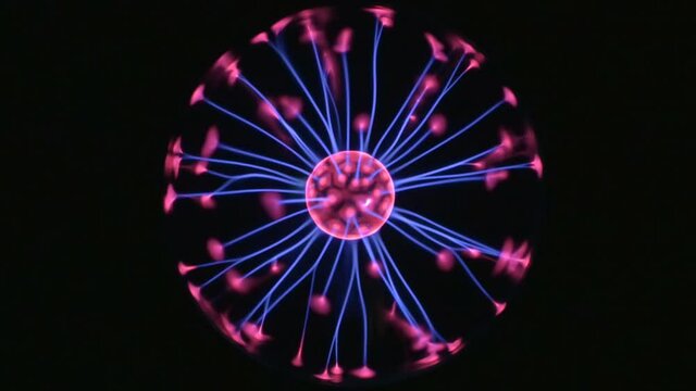 Plasma ball lamp with moving pink and blue filaments. Magic globe, orb in centre of black frame. Neon colored rays radiating and vibrating on dark background. 4K UHD 4096x2304 ultra high definition
