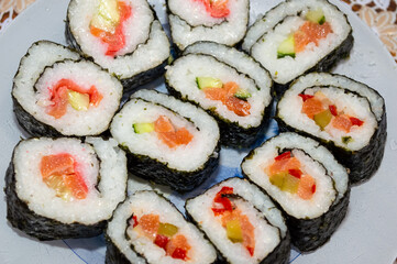 close-up - rolls with bright filling, laid out on a plate