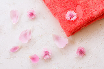 Towel and beauty flowers on a white background.