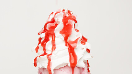 Pour Strawberry sauce whipped cream on white background, Food concept Front view..