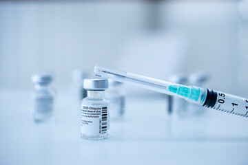 Corona virus vaccine and syringe. Stop covid-19 pandemic.
