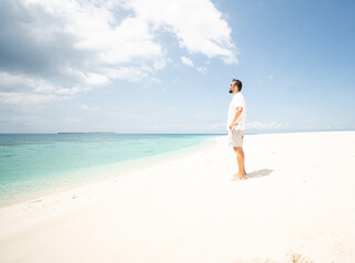 Fototapeta na wymiar One man is enjoying beautiful tropical beach