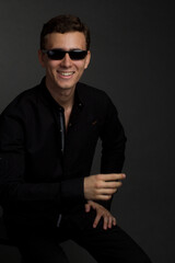 Obraz premium a young dark-haired man in black shirt