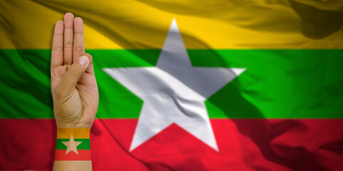 Banner of Flag of Myanmar (Burma) painted on male fist, fist flag, country of Myanmar, strength,...