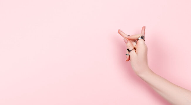 Woman hand showing hasta of indian classical dance. Caucasian female hands wearing silver rings. Meditation and self healing concept
