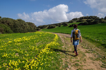 hiker walking the horse path, - Cami de Cavalls-,s'Albufera des Grau Natural Park, Menorca,...