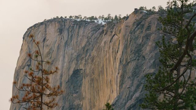 Time lapse of Firefall, a seasonal waterfall illuminated by the late sunlight in Yosemite National Park in California
