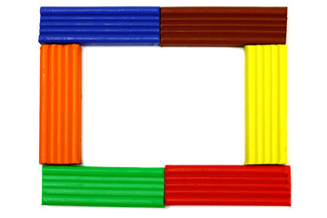 Frame made of colored plasticine on a white background. Copy space for text