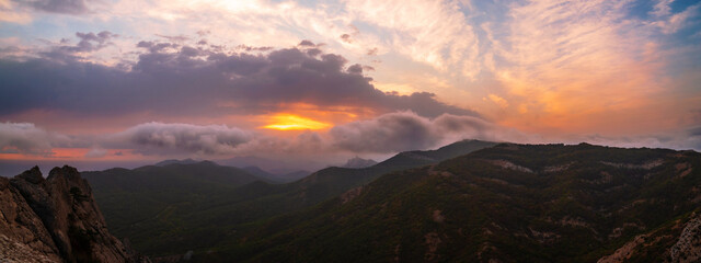 Fototapeta na wymiar Beautiful sunset in the mountains, panorama