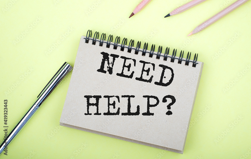 Poster need help text on notebook with pen on yellow background