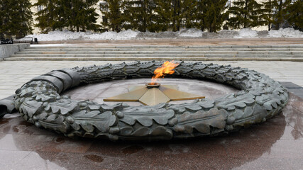Eternal flame from the forged star monument in honor of fallen soldiers. Eternal Peace. World War...