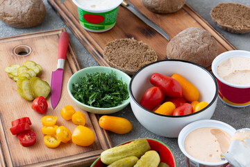 Fototapeta na wymiar Vegetables and spread for vegan sandwiches