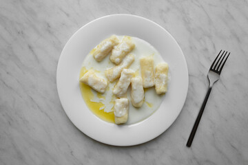 Closeup of dumplings with cottage cheese or Dumplings without filling - slavic light dish, vegetarian food, healthy breakfast