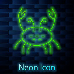 Glowing neon line Crab icon isolated on brick wall background. Vector.