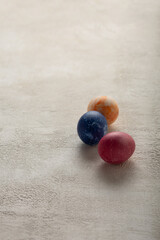 Painted Easter eggs on light concrete