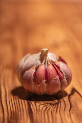 white garlic on wooden table