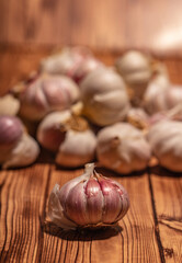 white garlic on wooden table