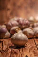 white garlic on wooden table