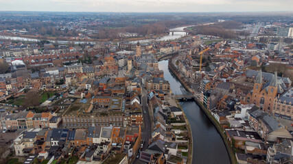 Aerial view of the Dender river crossing the Flemish city of Dendermonde