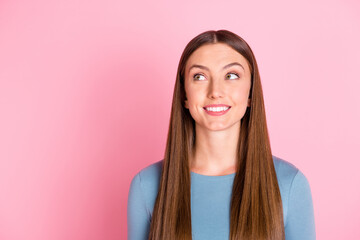 Photo of adorable cheerful person toothy smile look interested empty space isolated on pink color background