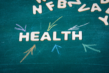 Fototapeta premium HEALTH. Care, treatment and diagnosis concept. White wooden alphabet letters
