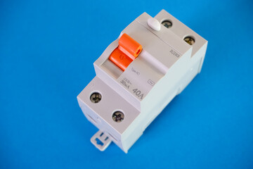 Automatic differential current switch on a blue background. Electrical engineering concept.