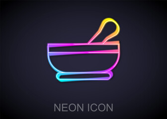 Glowing neon line Mortar and pestle icon isolated on black background. Vector.