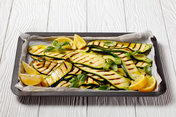 grilled zucchini slices on a sheet pan