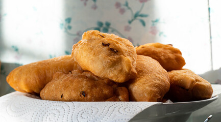 fried country pies. rustic cuisine. pies with potatoes on a plate