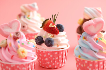 Colorful cupcakes isolated in pink background