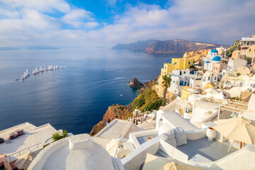 Fototapeta na wymiar Good vacation. Panoramic view of Santorini. The famous town of Oia in the morning.