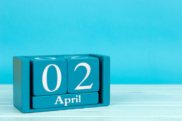 wooden calendar with date 2 april on blue wooden background, World Autism Awareness Day;...