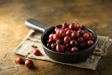 Fresh gooseberry in a white cup