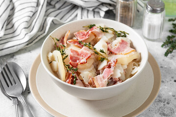 Baeckeoffe made from baked potatoes and bacon.Traditional French dish