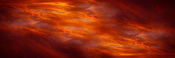 Abstract dark red background. Dramatic fiery bloody sky. Fantastic golden sunset background with...