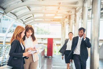 Business Partner using laptop online meeting team Partnership businessman, businesswoman talking together. Diversity Asian Business Partner online meeting trust teamwork. Asian Business team meeting.