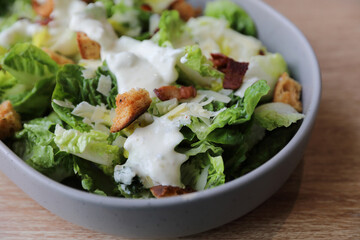 caesar salad appetizer on wooden background