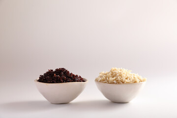 Organic boiled brown rice on bowl isolated in white background
