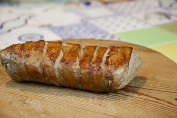 bacon roast pork on wooden cutting board