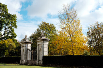 Fototapeta na wymiar Holland Park gates in a Autumn day.