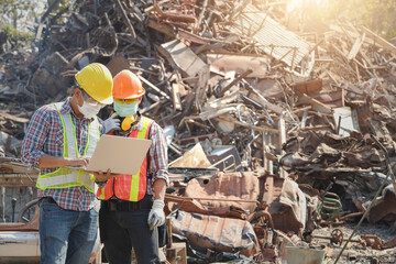 Recycling industry a worker who recycling thing on recycle center.Manager and Manual Worker in Metal Landfill