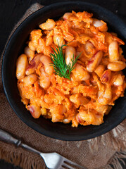 Stewed white beans with carrot in tomato sauce