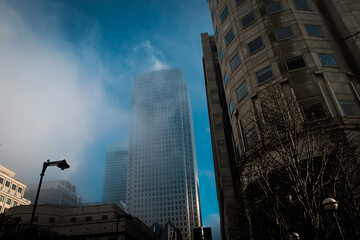 Canary Wharf skyscrapers under the fog.