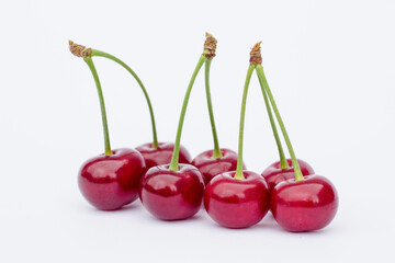 cherries on white background,
ripe cherry