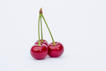 cherries on white background,
ripe cherry
