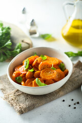 Healthy roasted carrot with fresh basil