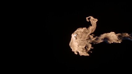 Slow-motion video of fire and flames. A fire pit, burning gas or gasoline burns with fire and flames. A hellish glow of fire in the dark with copy space