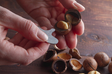 Open macadamia nuts with a metal nut cracking wrench