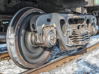 A railway bogie on the rails. Close-up.