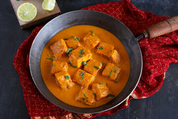 Paneer butter masala , Paneer tikka masala curry Delhi Mumbai North Indian vegetarian side dish  Cooking butter paneer made using cottage cheese, Indian spices 4K slow motion video, footage Kerala, 
